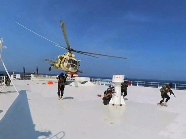 A grab from handout footage released by Yemen's Huthi Ansarullah Media Centre purportedly shows members of the rebel group during the capture of an Israel-linked cargo vessel. Picture: AFP