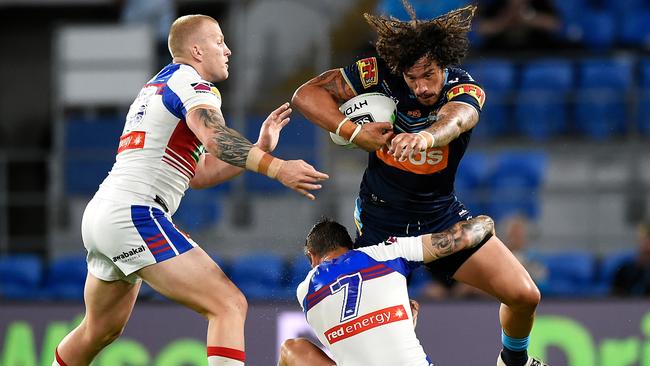 Mitch Barnett tackles Kevin Proctor with Mitchell Pearce.