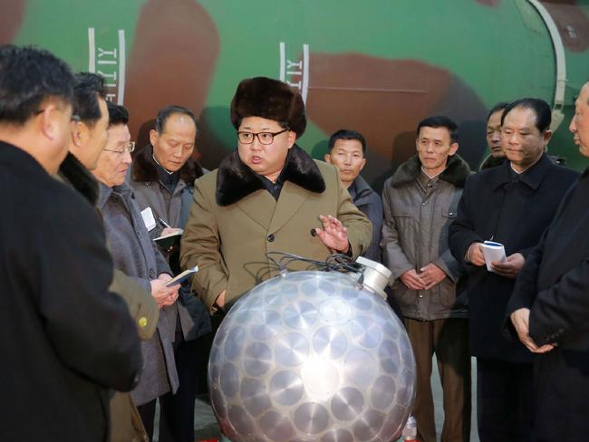 North Korean leader Kim Jong-Un meeting with the scientists and technicians in the field of researches into nuclear weapons and guiding the work for boosting the nuclear arsenal at an undisclosed location.