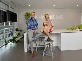 FORGING A PATH: Paul Bryan and Anna Vivash from Penny Wood Lane Boutique Real Estate Agency, with Louie. Picture: Stuart Quinn