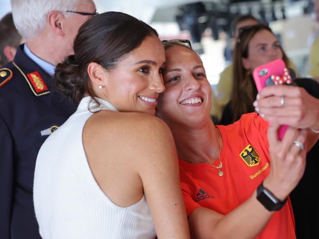 Meghan Markle poses for a selfie with one of the Invictus athletes. Picture: Chris Jackson/Getty Images for Invictus Games Dusseldorf 2023