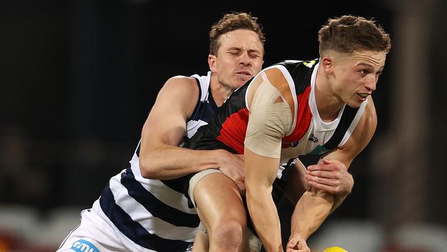 Cat Mitch Duncan wraps up Saint Jack Billings during Monday night’s game. Picture: Michael Klein