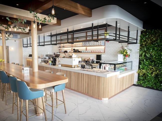 The fresh, spacious fit-out at new North Hobart cafe Lazy Brunch features a high central bench that includes multiple charging points – perfect for doing some WFH (or work from cafe as the case may be). Picture: Chris Kidd