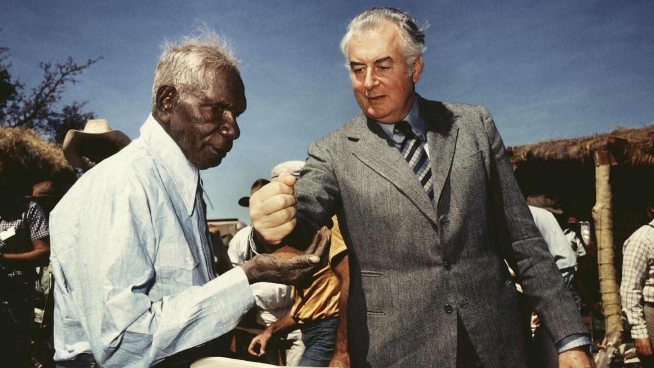 Prime Minister Gough Whitlam pours soil into the hands of traditional land owner Vincent Lingiari, Northern Territory 1975.