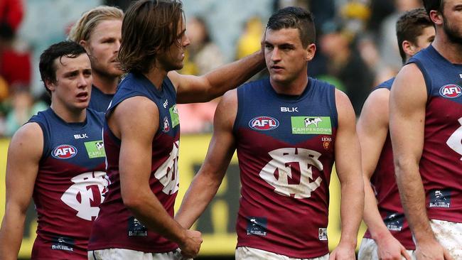 Rhys Mathieson gives Tom Rockliff a pat on the head after a loss. Picture: Colleen Petch