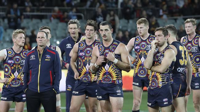 Don Pyke with his Crows team after the 57-point hiding. Picture SARAH REED