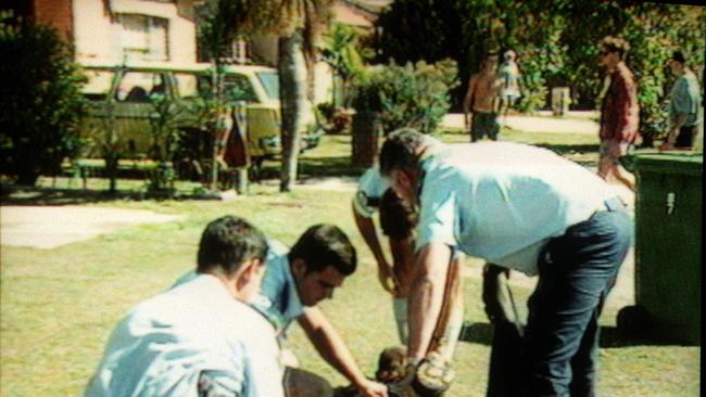 An injured person being treated after the shooting in Tugun on November 9, 1996. COURTESY CH 9