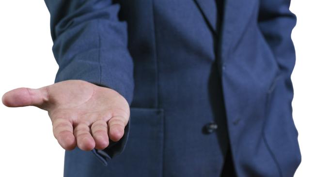 The businessman's photo in blue suit. The man offers a hand. iStock "more money please"