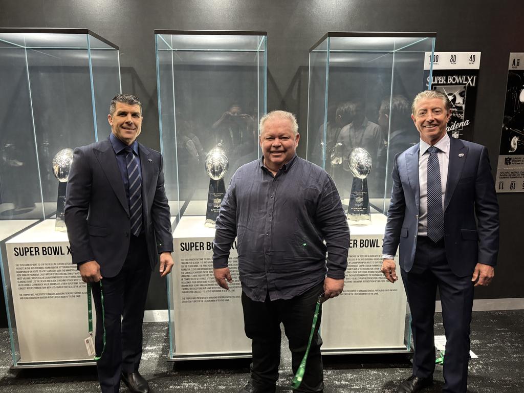 Fox League's Michael Ennis, Steve Crawley and Greg Alexander with the Raiders' Super Bowl trophies.