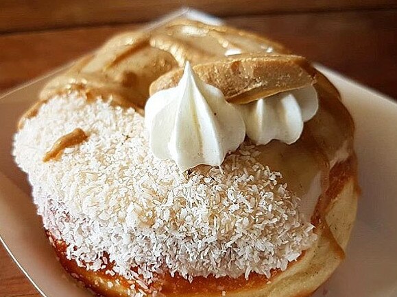 A caramel sauce and whipped cream coconut donut from the Flour of Life Bakery, one of the plant-based foodie businesses involved in The LC Miami.