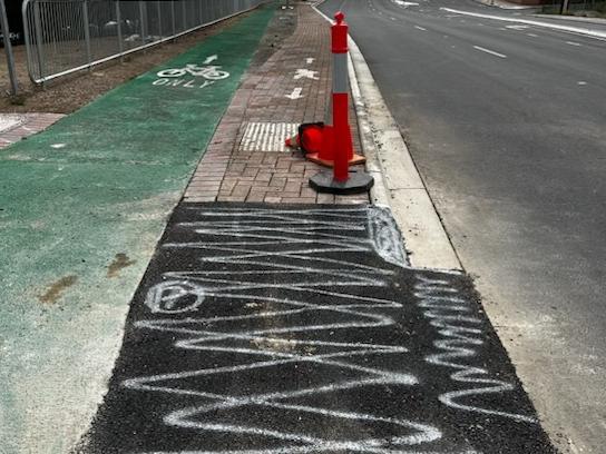 Changes have been made to the Flagstaff Rd, Darlington, bikeway blamed for the death last month of a cyclist. A concrete tripping hazard, pictures behind this warning cone, has been removed. Pictures: Frank Pangallo.,