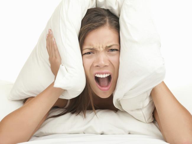 RendezView. Loud. Woman with pillow over head. Noise. Too loud. Generic. Angry. Annoyed.