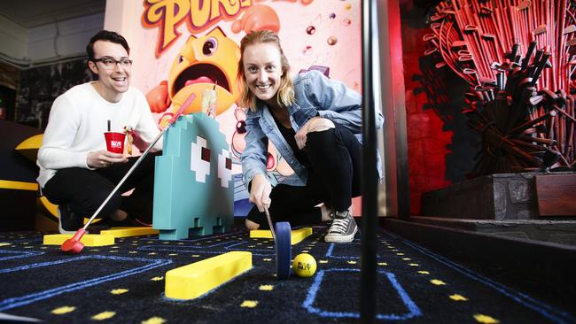 Mattia Bondanza and Jane Zouch play putt putt at Holey Moley in Newtown. Picture: Justin Lloyd