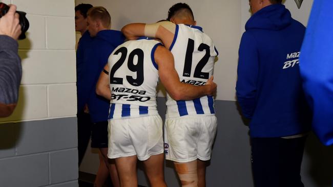 Brent Harvey and Lindsay Thomas embrace after the match.