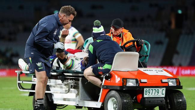 Corey Harawira-Naera of the Raiders is driven off the field.