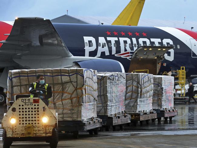 Palettes of N95 respirator masks are off-loaded from the New England Patriots football team's customised Boeing 767 jet on return from China. Picture: AP