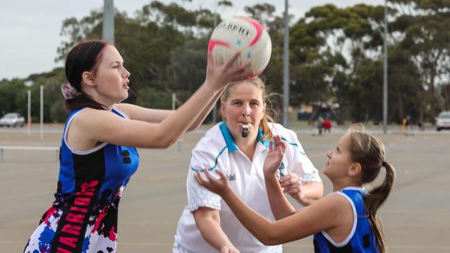 Nicola Slade is a coach and player at Warriors Netball Club with her daughter Rhiannan, 16, and Taylah Manuel, 11. All three are keen to see netball get the green light to return. Picture: Russell Millard