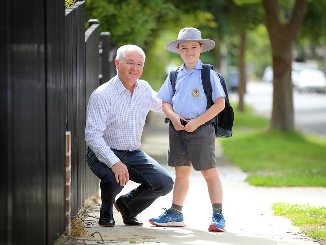 John Williams his son Liam, 8, for a story about the rise in private school fees state by state and what percentage of household income private school fees eat up. Victoria has the most expensive schools in the country but parents are still prioritising education and willing to pay the high fees - some up to $40,000. Picture: Alex Coppel.