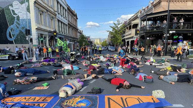 Extinction Rebellion protesters hold up traffic at the corner of Frome Road and Rundle Street. Picture: Caleb Bond