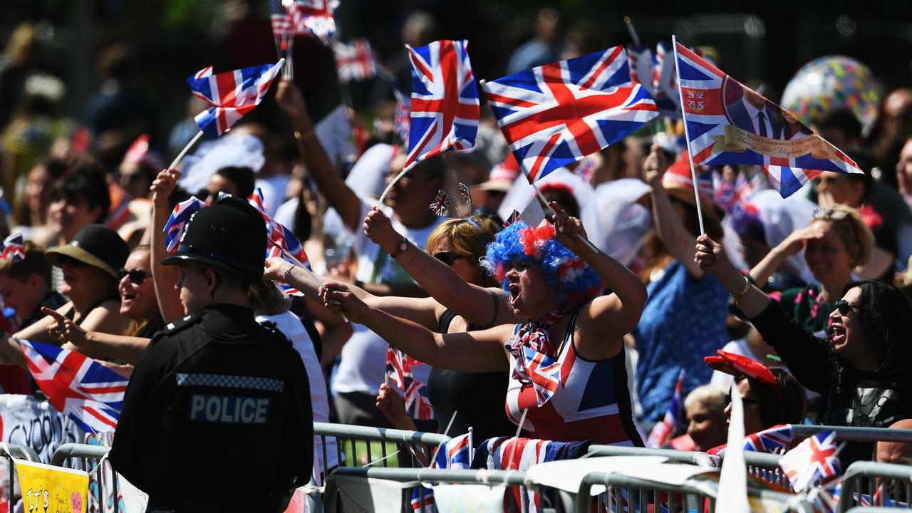 Joyful crowds gathered to celebrate the royal wedding in England. Picture: Jeff J Mitchell/Getty Images