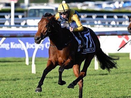 Stefi Magnetica and Zac Lloyd on their way to winning the Stradbroke Handicap at Eagle Farm on Saturday. Picture: Grant Peters/Trackside Photography.