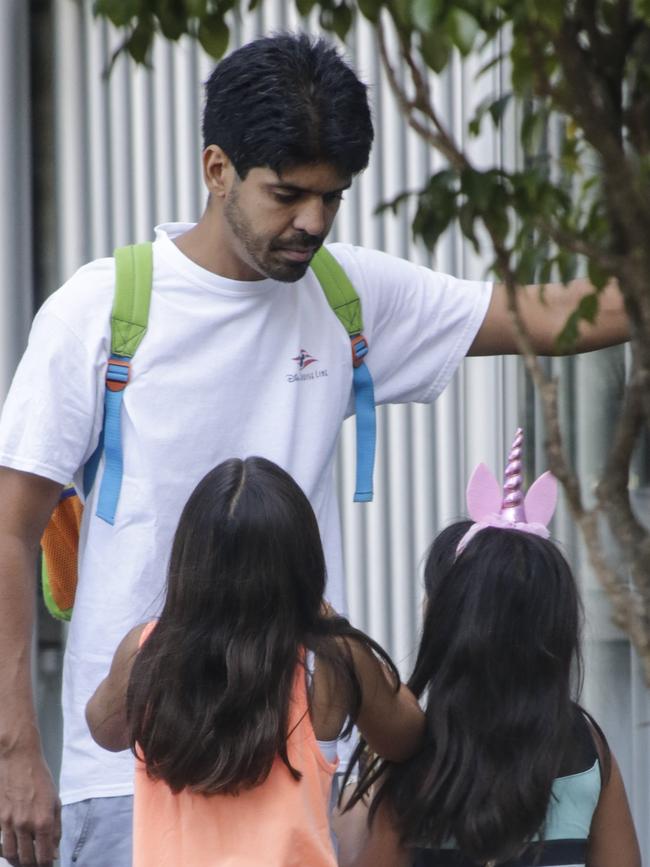 Mr Santoro with his two children in Copacabana, Brazil. Picture: Alex Ribeiro