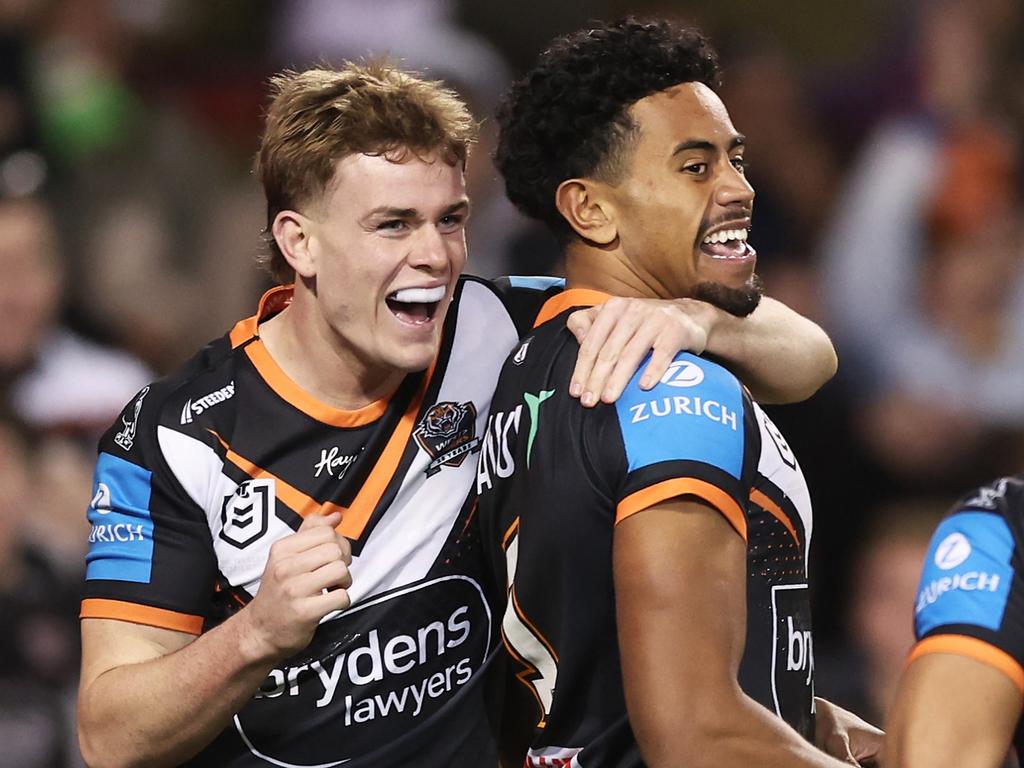 SYDNEY, AUSTRALIA - JUNE 23: Jahream Bula of the Tigers celebrates with team mates after scoring a try during the round 16 NRL match between Wests Tigers and Canberra Raiders at Campbelltown Stadium, on June 23, 2024, in Sydney, Australia. (Photo by Matt King/Getty Images)