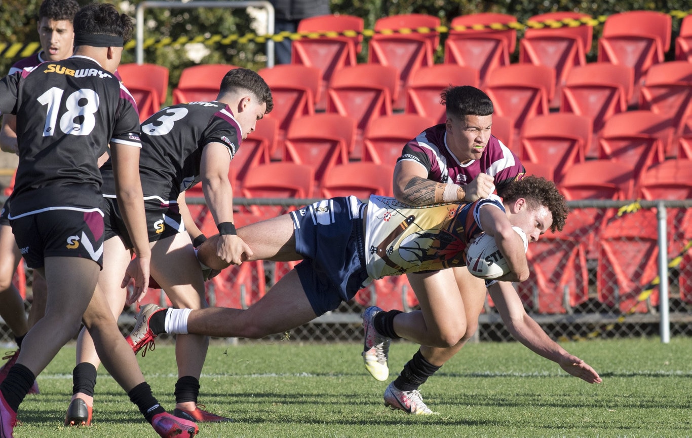 Blake Cesari, St Mary's tackled.