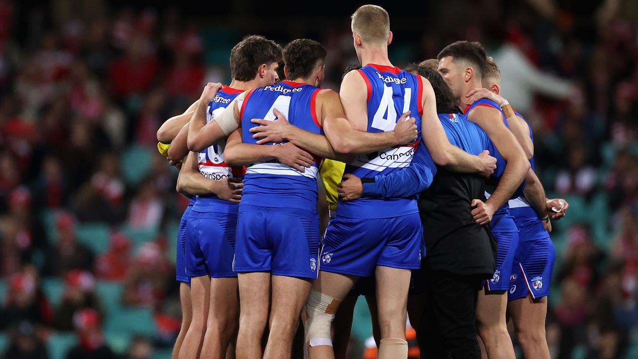Bulldogs players huddle before their horror start against the Swans. Picture: Cameron Spencer