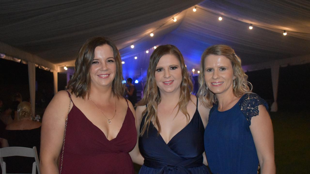 Zoe Kerr of Moranbah, Melissa Kliese of Moranbah, and Kristi-lee Mewah of Jubilee Pocket at the 2021 Proserpine Show Ball. Picture: Kirra Grimes.