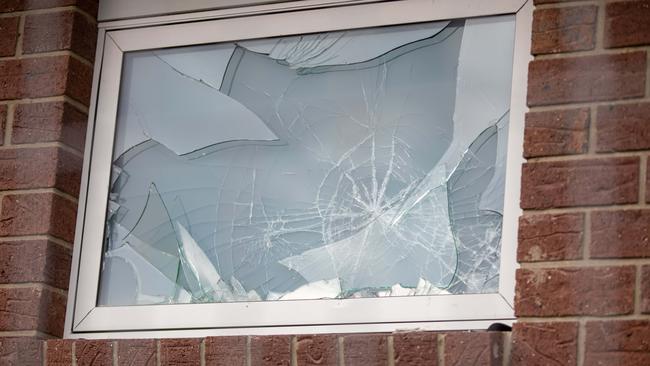 One of the broken windows at the Fisher Drive, Herdsmans Cove development. Picture: Linda Higginson