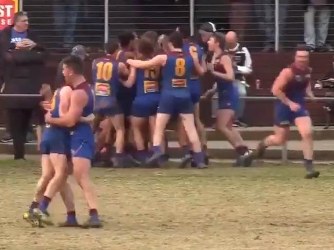 Banyule players celebrate the win over Thomastown.