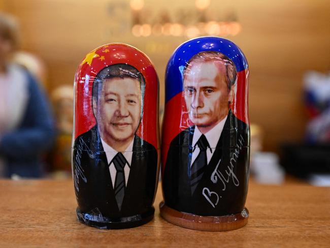 Traditional Russian wooden nesting dolls, called Matryoshka, depicting Chinese President Xi Jinping and Russian President Vladimir Putin. Picture: AFP