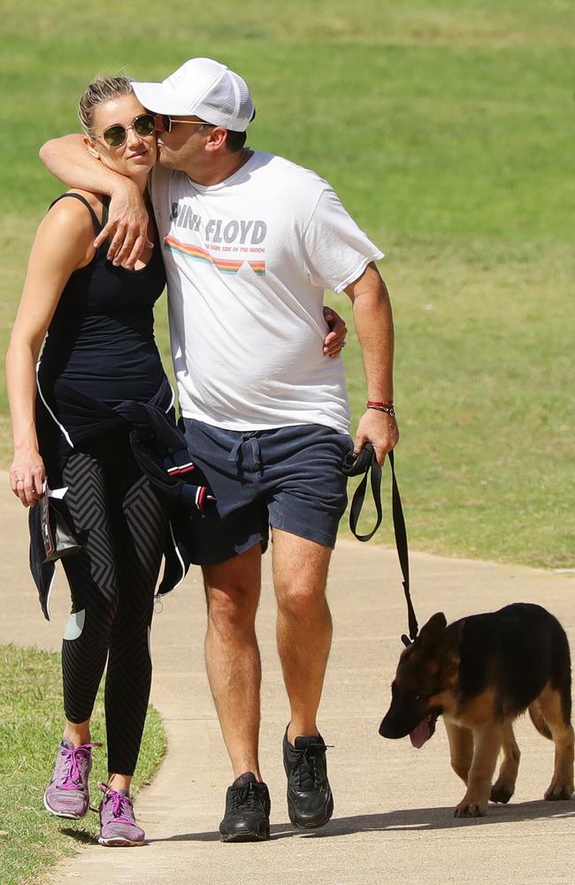 Karl Stefanovic and bride Jasmine Yarbrough take the Chance the Yapper for a walk. Picture: Matrix