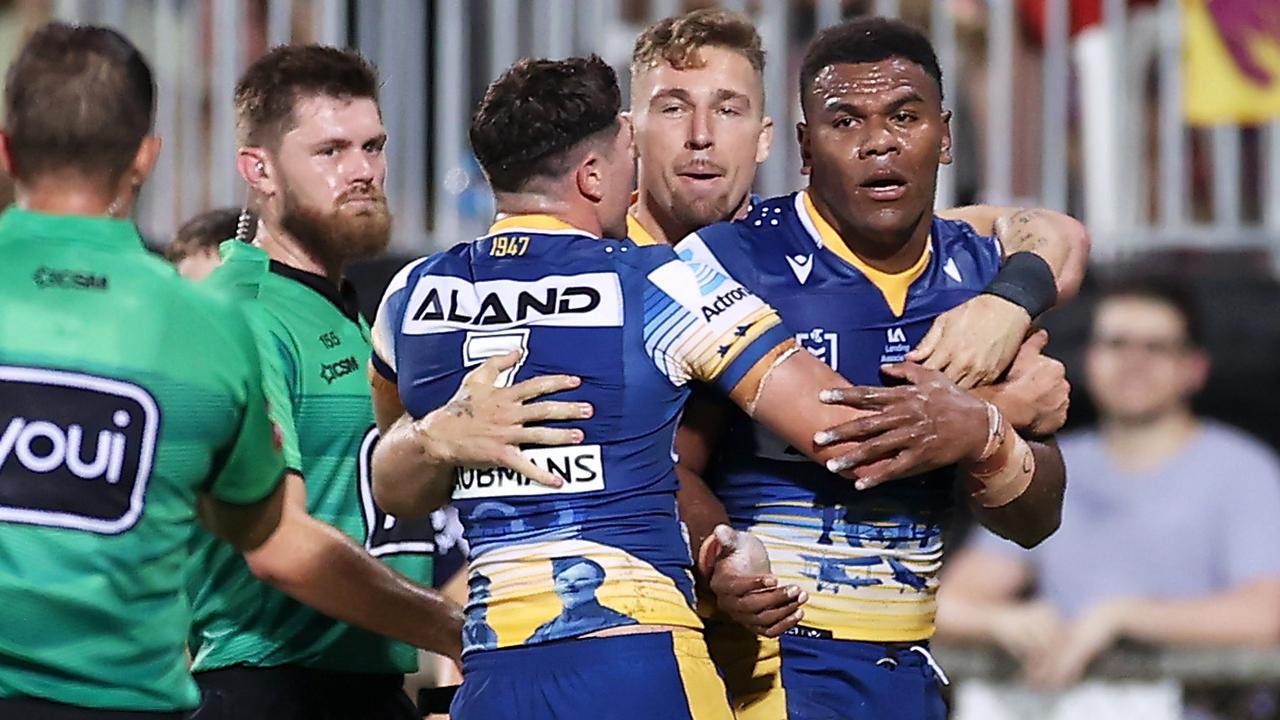 Maika Sivo of the Eels celebrates with his teammates after scoring a try.