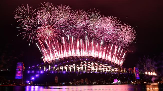 The midnight fireworks lighting up Sydney Harbour on New Year’s Eve last year. Picture: AAP Image