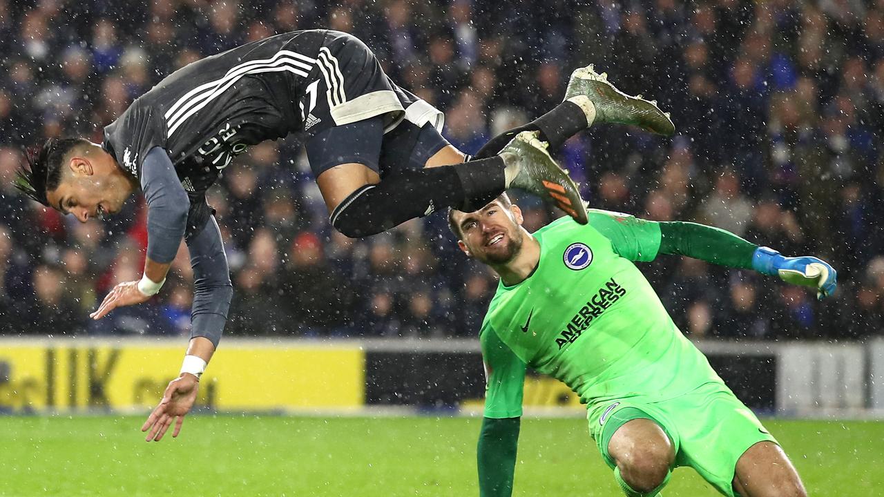 Ayoze Perez goes airborne after a tackle from Matt Ryan in Brighton’s loss to Leicester City.