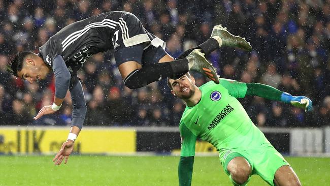 Ayoze Perez goes airborne after a tackle from Matt Ryan in Brighton’s loss to Leicester City.