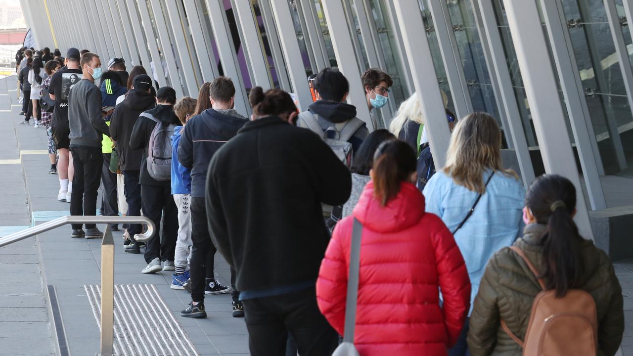 People line up to get their Covid vaccinations at the Melbourne Exhibition Centre. Picture: NCA NewsWire / David Crosling