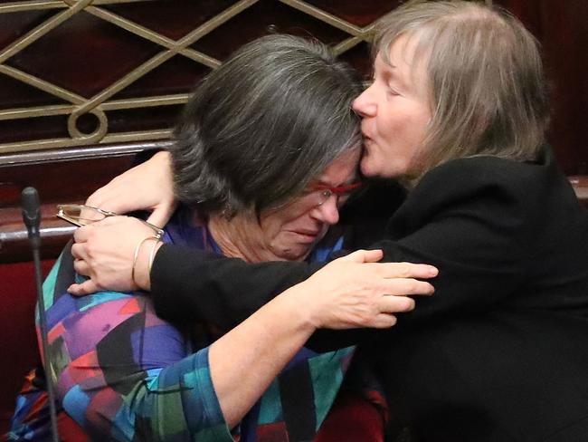 Greens MPs Colleen Hartland and Samantha Dunn weep and embrace. Picture: Scott Barbour/Getty Images