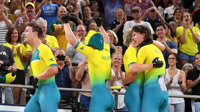 Kelland O'Brien, Alex Porter, Sam Welsford and Leigh Howard of Australia celebrate winning the Mens Team Pursuit Finals on day one of the XXI Commonwealth Games, at the Gold Coast, Australia, Thursday, 5 April 2018 . (AAP Image/Dan Peled) NO ARCHIVING, EDITORIAL USE ONLY