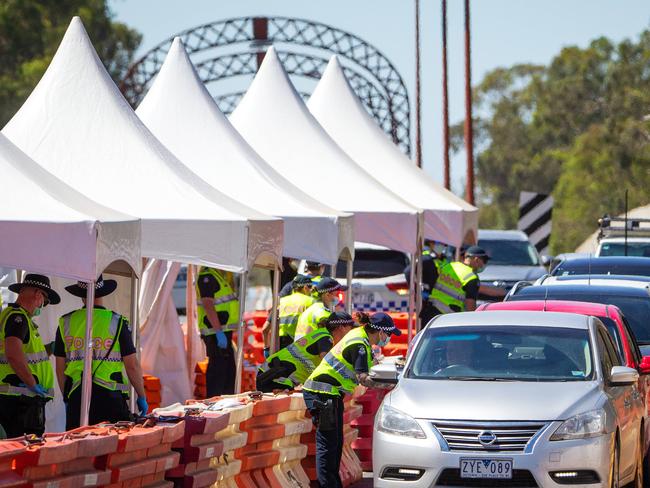 Victoria Police man a checkpoint on the Echuca-Moama bridge, the border between Victoria and New South Wales. Holiday trade in Echuca is steady but down after recent Covid-19 border closures. Picture: Mark Stewart