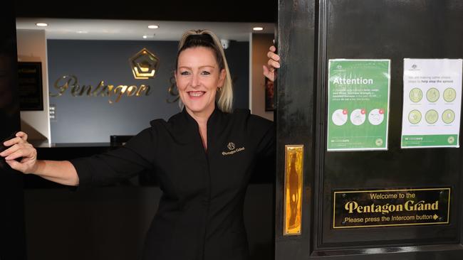 Pentagon Grand manager Suzanne Pfeifer in front of COVID safe signage at the brothel in Ashmore. Picture Glenn Hampson