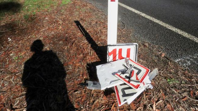 Damaged emu warning signs on Brooms Head road.