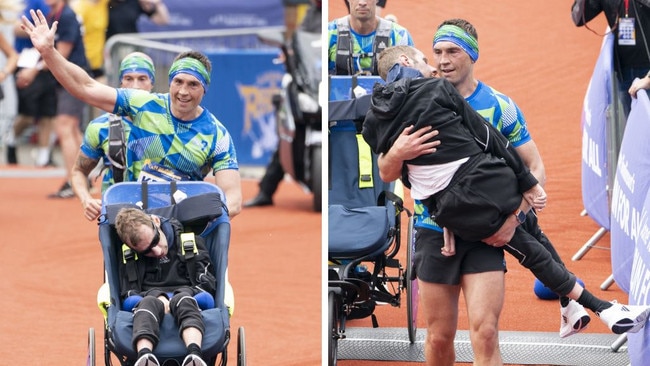 Kevin Sinfield pushed and then carried Rob Burrow at the Leeds marathon. (Photo by Danny Lawson/PA Images via Getty Images)