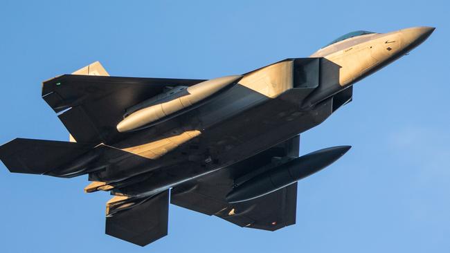 The US Airforce's F-22 Raptors soar above Amberley Air Base in Queensland whilst in Australia to take part in Operation Talisman Sabre. PIC: Beau Chenery.