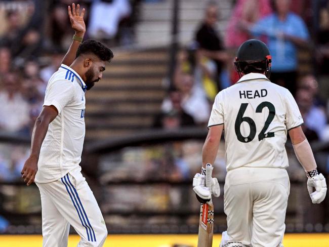 India's Mohammed Siraj shows Travis Head the path to the dressing room at the Adelaide Oval. Picture: AFP