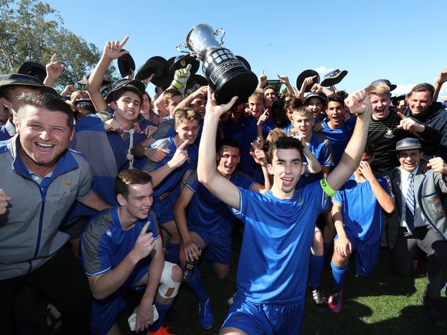 Churchie Captain with the cup Lachlan Smith Churchie v Nudgee football final. Pic Annette Dew