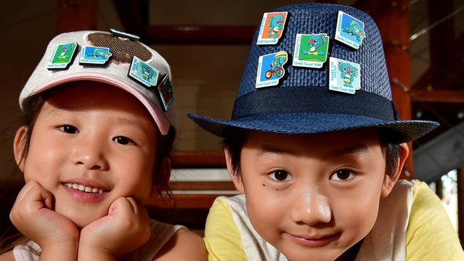 Sister and brother Tanya, 6, and Isaac Ha, 7, wear the new Commonwealth Games Pins on their hats.  Picture: Bianca De Marchi