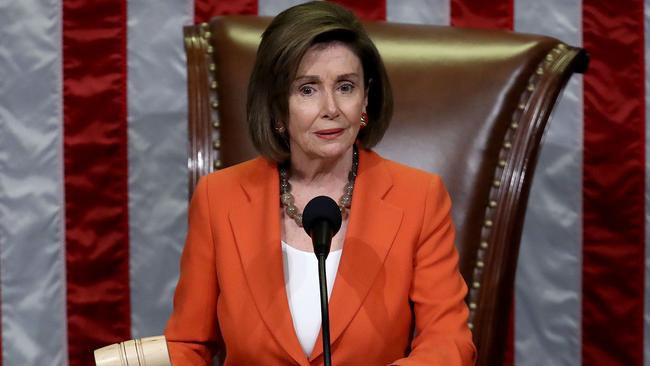 Speaker of the US House of Representative Nancy Pelosi hits the gavel to close the vote on a resolution formalising the impeachment inquiry into Donald Trump. Picture: AFP